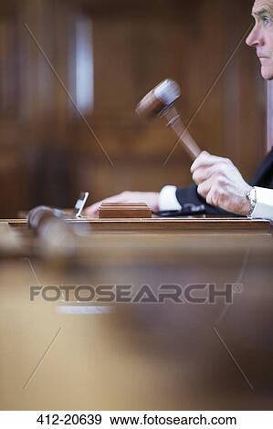Stock Photo - Judge banging gavel in court . Fotosearch