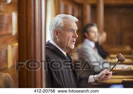 Stock Photograph - Judge banging gavel in court. Fotosearch