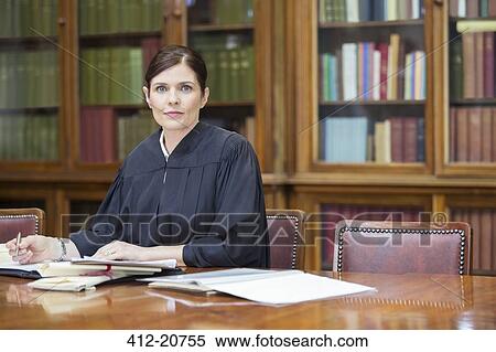 Stock Photography - Judge doing research in chambers. Fotosearch