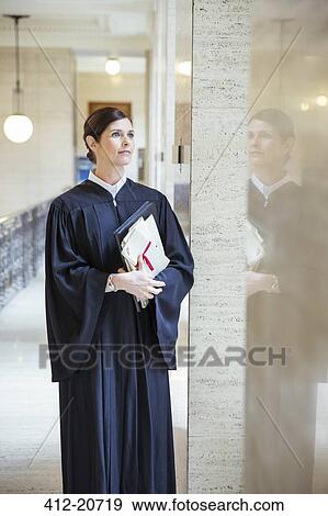Judge looking out window in courthouse View Large Photo Image Stock Photo - Judge looking out window in courthouse. Fotosearch