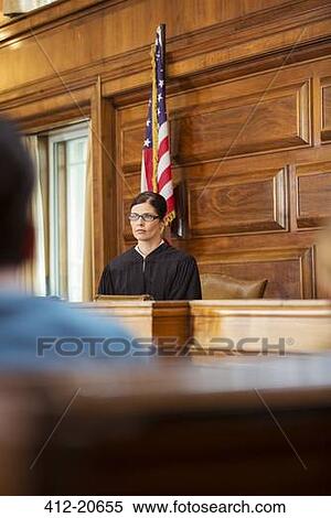 Stock Photography - Judge sitting at judges bench in court . Fotosearch