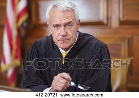 Judge sitting behind judges bench in court View Large Photo Image Stock Image - Judge sitting behind judges bench in court. Fotosearch
