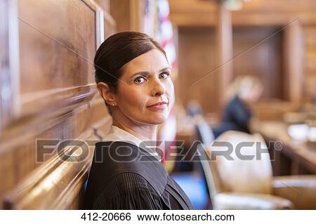 Judge standing in courtroom View Large Photo Image Stock Photograph - Judge standing in courtroom. Fotosearch