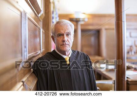 Judge standing in courtroom View Large Photo Image Stock Photograph - Judge standing in courtroom. Fotosearch