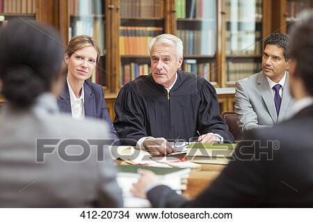 Judge talking with lawyers in chambers View Large Photo Image Picture - Judge talking with lawyers in chambers. Fotosearch