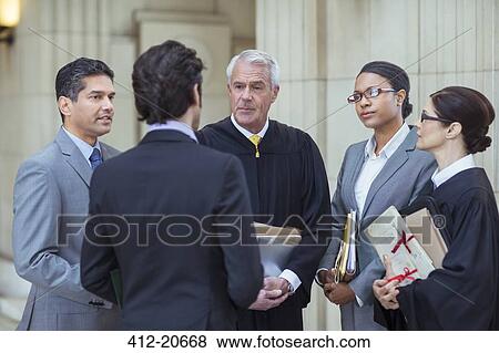 Judges and lawyers talking in courthouse View Large Photo Image Stock Photo - Judges and lawyers talking in courthouse . Fotosearch