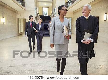 Picture - Judges and lawyers walking through courthouse . Fotosearch