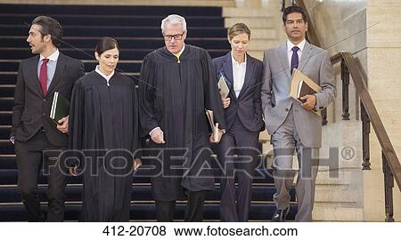 Judges and lawyers walking through courthouse together View Large Photo Image Stock Photo - Judges and lawyers walking through courthouse together. Fotosearch