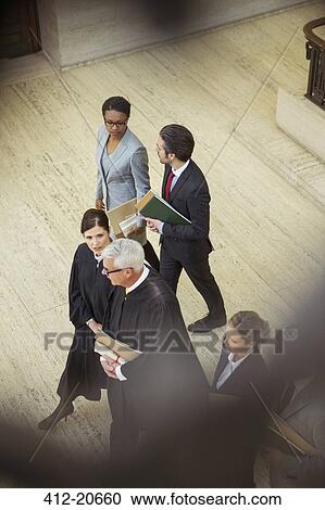 Judges and lawyers walking together in courthouse View Large Photo Image Stock Image - Judges and lawyers walking together in courthouse. Fotosearch