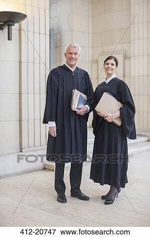 Judges standing together in courthouse View Large Photo Image Stock Photo - Judges standing together in courthouse. Fotosearch