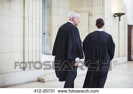 Judges walking through courthouse together View Large Photo Image Stock Image - Judges walking through courthouse together . Fotosearch