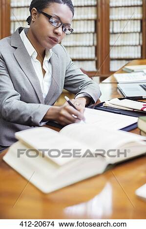 Lawyer doing research in chambers View Large Photo Image Picture - Lawyer doing research in chambers . Fotosearch