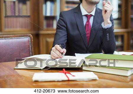 Lawyer doing research in chambers View Large Photo Image Stock Image - Lawyer doing research in chambers . Fotosearch
