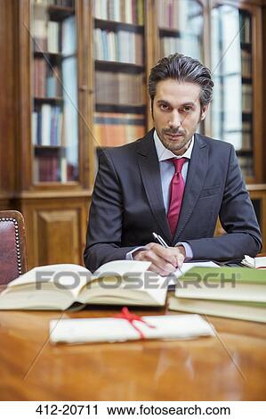 Lawyer doing research in chambers View Large Photo Image Stock Image - Lawyer doing research in chambers. Fotosearch