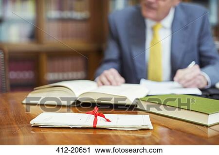 Lawyer researching in chambers View Large Photo Image Stock Image - Lawyer researching in chambers. Fotosearch