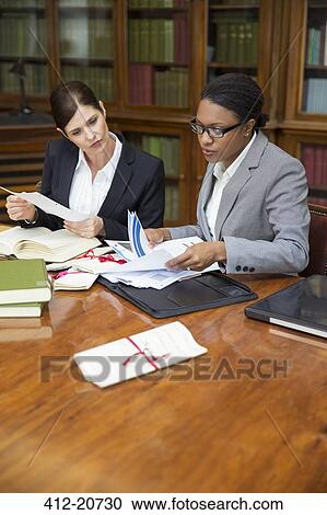 Lawyers doing research together in chambers View Large Photo Image Stock Image - Lawyers doing research together in chambers. Fotosearch