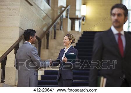 Lawyers shaking hands in courthouse View Large Photo Image Stock Photo - Lawyers shaking hands in courthouse . Fotosearch