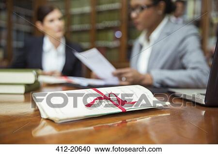 Stock Image - Lawyers talking in chambers. Fotosearch