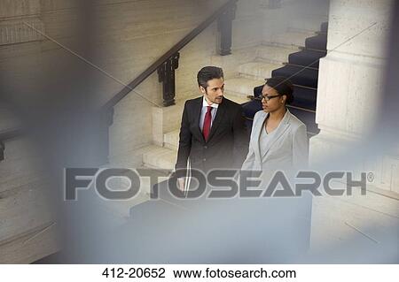 Lawyers walking downstairs in courthouse View Large Photo Image Stock Image - Lawyers walking downstairs in courthouse. Fotosearch