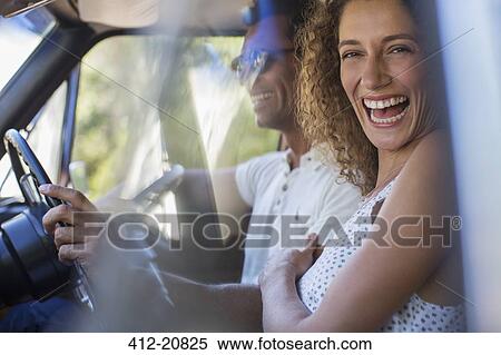 Stock Photography - Couple riding in car together. Fotosearch