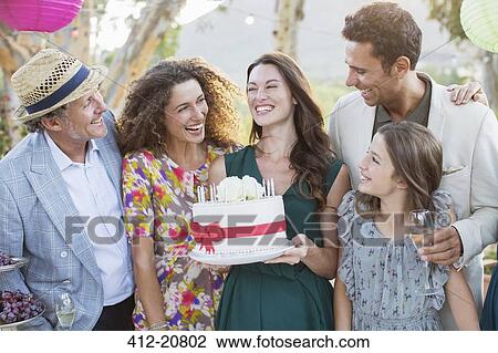 Family celebrating birthday together  View Large Photo Image Stock Image - Family celebrating birthday together . Fotosearch