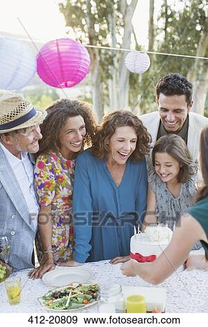 Family celebrating birthday with family View Large Photo Image Stock Photo - Family celebrating birthday with family . Fotosearch