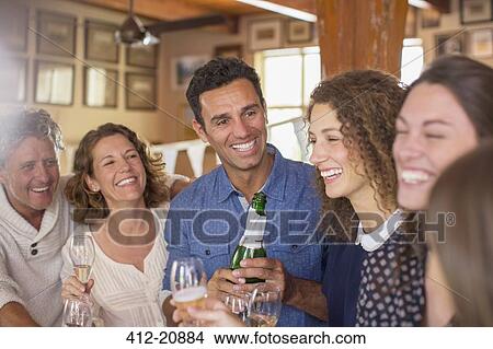 Picture - Family celebrating with drinks. Fotosearch