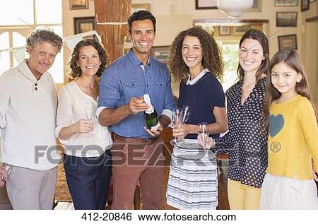Family celebrating with drinks View Large Photo Image Stock Photograph - Family celebrating with drinks . Fotosearch