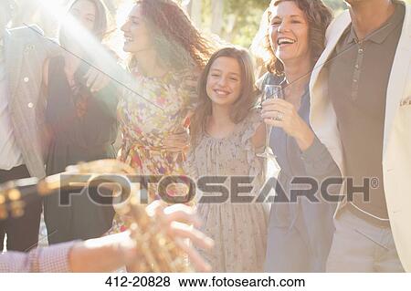 Family dancing together outdoors View Large Photo Image Stock Photo - Family dancing together outdoors. Fotosearch