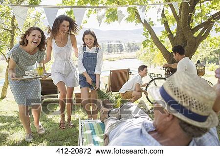 Stock Image - Family enjoying the outdoors together. Fotosearch
