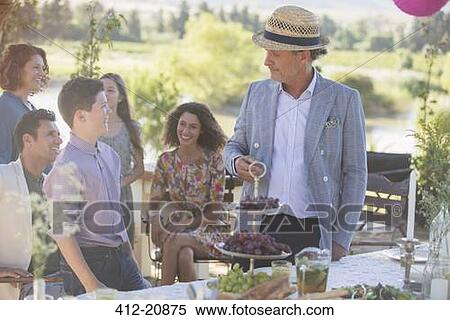 Family talking near picnic table View Large Photo Image Stock Photography - Family talking near picnic table. Fotosearch