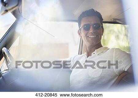 Man driving car on sunny day View Large Photo Image Stock Photography - Man driving car on sunny day. Fotosearch