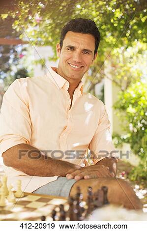 Man playing cheese outdoors View Large Photo Image Stock Photo - Man playing cheese outdoors. Fotosearch