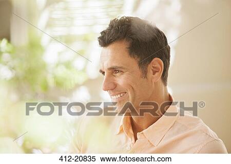 Man smiling indoors View Large Photo Image Stock Photography - Man smiling indoors. Fotosearch