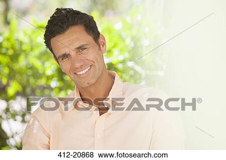 Man smiling outdoors View Large Photo Image Stock Photo - Man smiling outdoors . Fotosearch