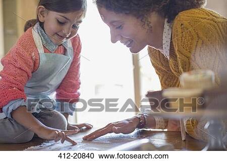 Mother and daughter playing in flour together View Large Photo Image Stock Image - Mother and daughter playing in flour together . Fotosearch