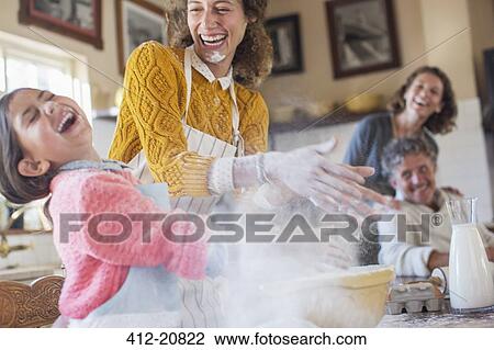 Mother and daughter playing with flour in the kitchen View Large Photo Image Stock Image - Mother and daughter playing with flour in the kitchen. Fotosearch