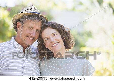 Older couple hugging outdoors View Large Photo Image Stock Photography - Older couple hugging outdoors. Fotosearch
