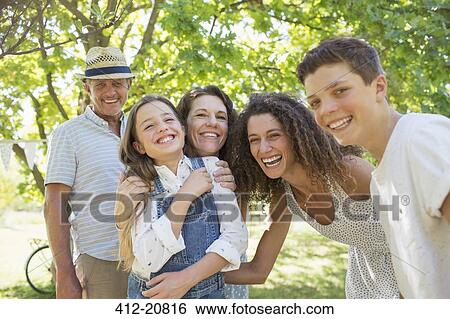 Stock Photograph - Smiling family playing together. Fotosearch