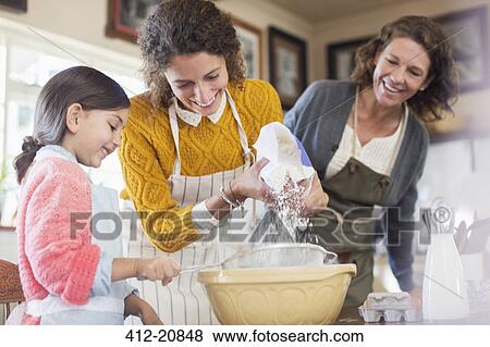 Three generations of woman baking together View Large Photo Image Stock Photo - Three generations of woman baking together. Fotosearch