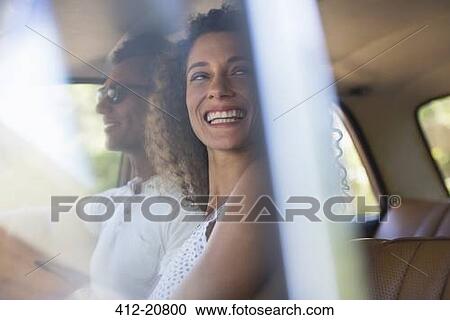 Woman riding in car with boyfriend View Large Photo Image Stock Image - Woman riding in car with boyfriend. Fotosearch