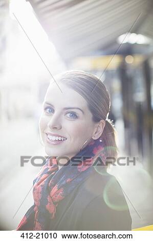 Woman smiling on city street on sunny day View Large Photo Image Stock Image - Woman smiling on city street on sunny day . Fotosearch