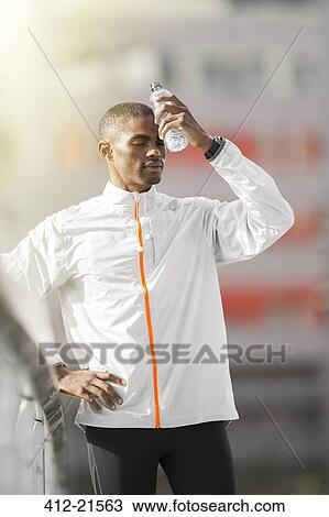 Stock Image - Man resting after exercise . Fotosearch