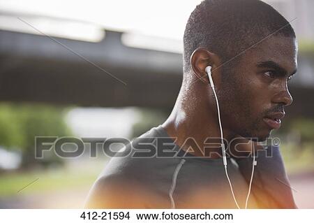 Man resting after exercising on city street View Large Photo Image Picture - Man resting after exercising on city street. Fotosearch