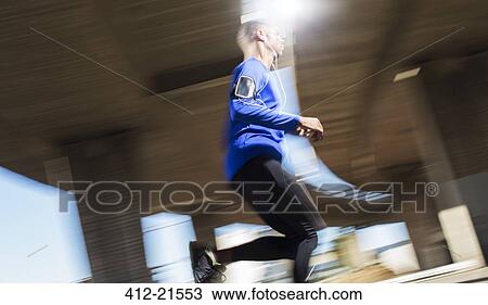 Stock Image - Man running outdoors. Fotosearch