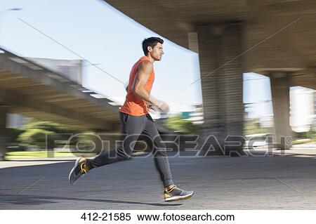 Stock Photography - Man running through city streets . Fotosearch