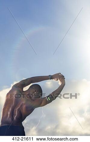 Man stretching before exercising outdoors View Large Photo Image Stock Image - Man stretching before exercising outdoors. Fotosearch