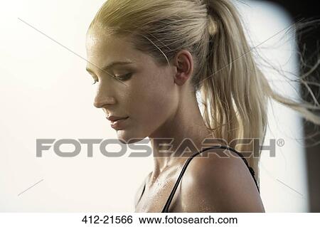 Stock Photograph - Woman exercising outdoors. Fotosearch