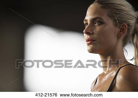 Stock Photograph - Woman exercising outdoors. Fotosearch