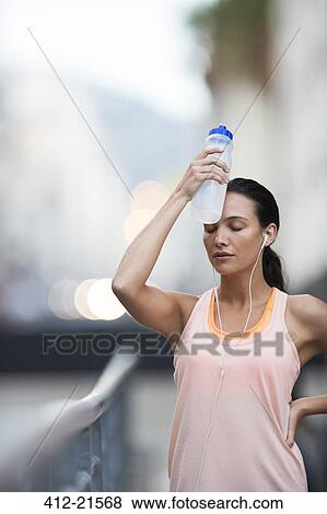 Woman resting after exercise View Large Photo Image Stock Photo - Woman resting after exercise. Fotosearch